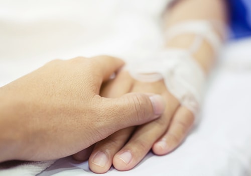 Patient hand in hospital bed Patient hand in hospital bed