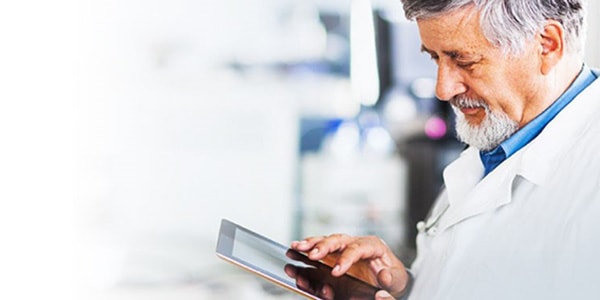 Physician looking at ipad