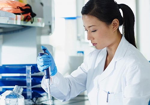 Lab tech with pipette