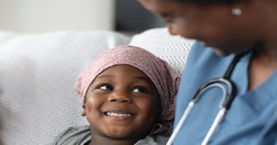 Young child with nurse in hospital -setting